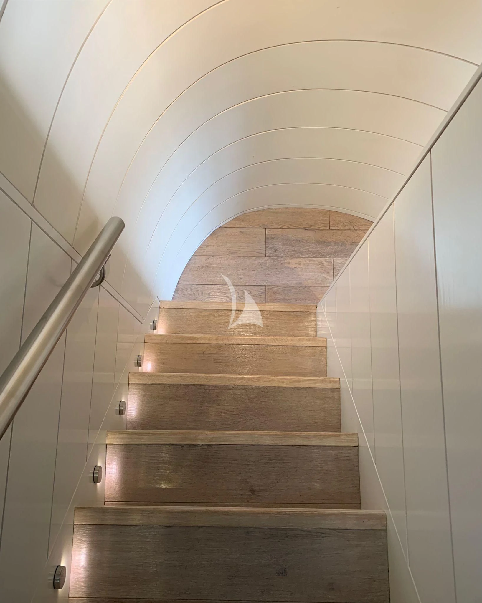 a staircase with a light aboard VERVECE Yacht for Charter