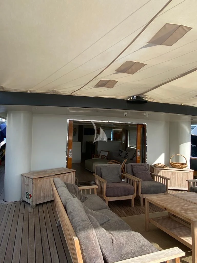 a living room with a couch and a table aboard VERVECE Yacht for Charter