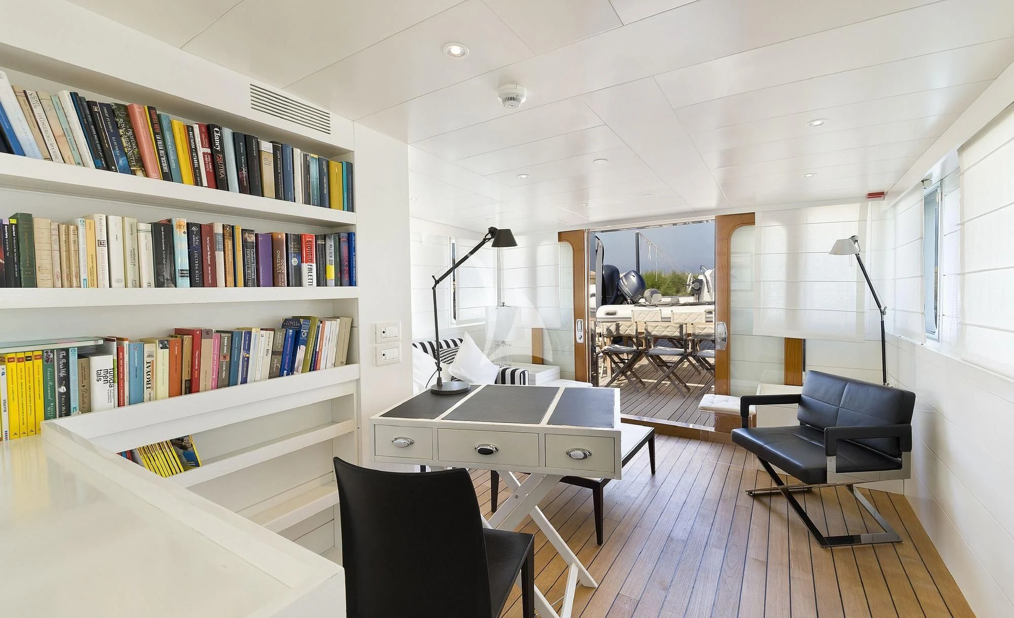 a room with a desk and shelves aboard VERVECE Yacht for Charter