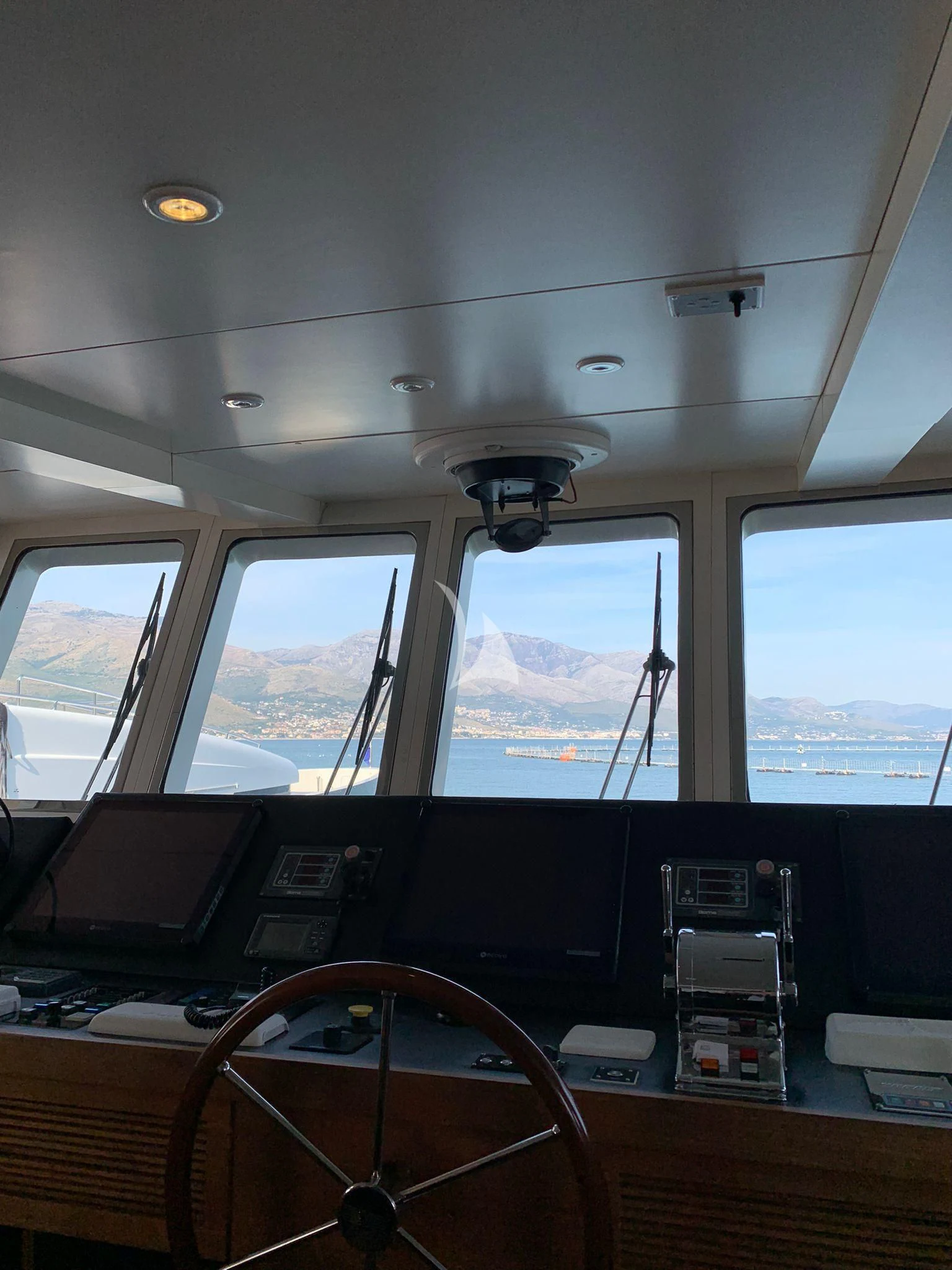 inside of a vehicle with a view of the water and the land below aboard VERVECE Yacht for Charter