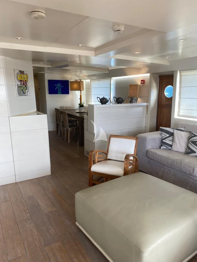 a living room with a couch and a table aboard VERVECE Yacht for Charter