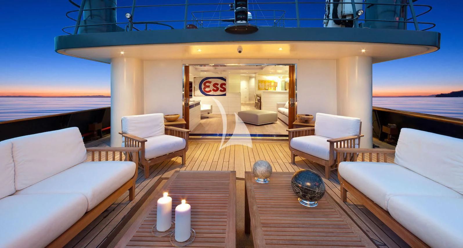 a living room with a large window aboard VERVECE Yacht for Charter