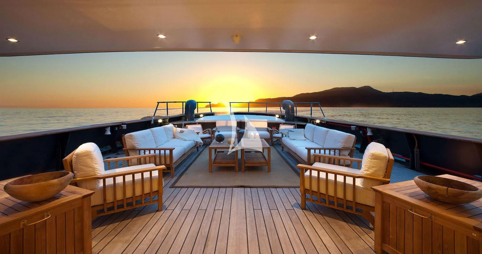 a large room with a deck and chairs and a large body of water aboard VERVECE Yacht for Charter