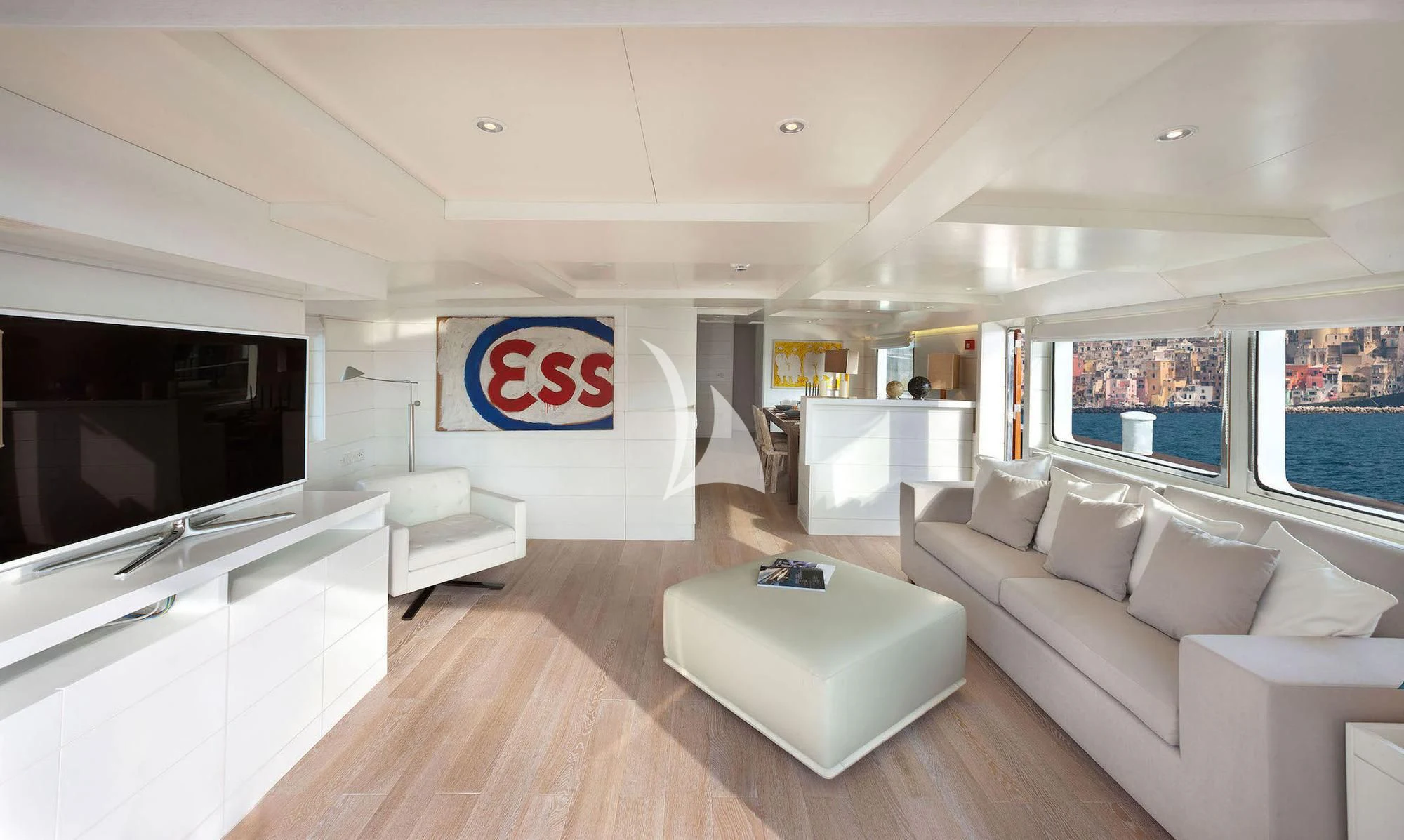 a living room with a large window aboard VERVECE Yacht for Charter