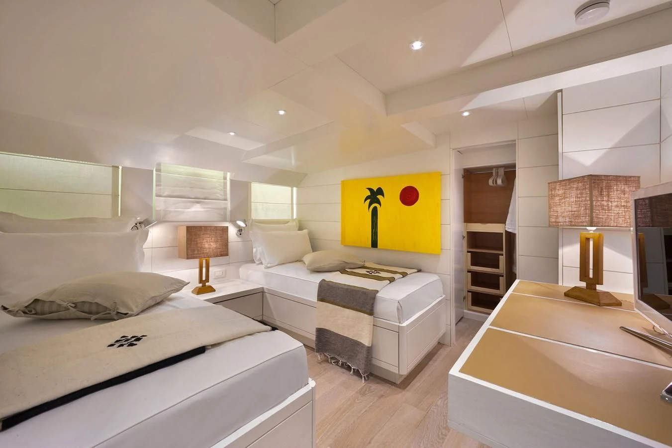 a room with a bed and a desk aboard VERVECE Yacht for Charter