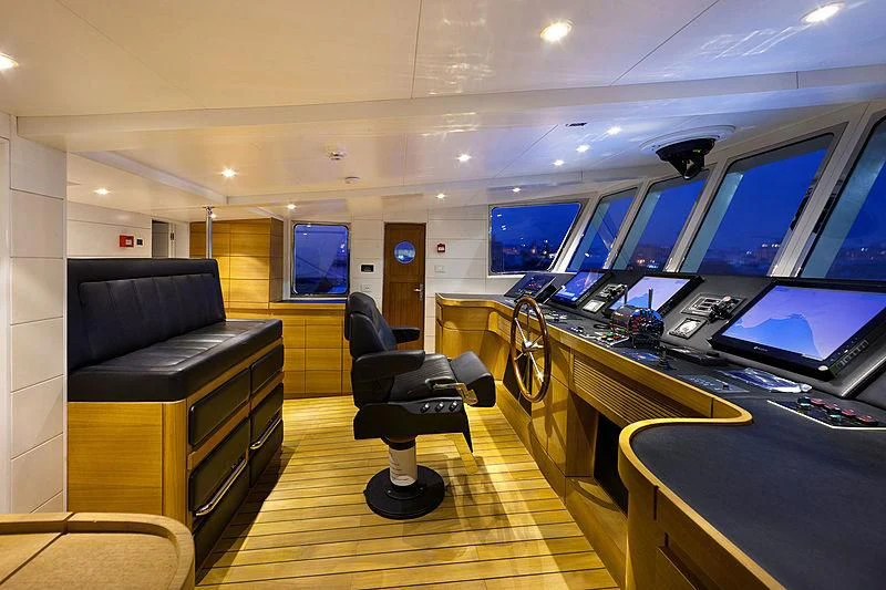 an office with a large desk and computer screens aboard VERVECE Yacht for Charter