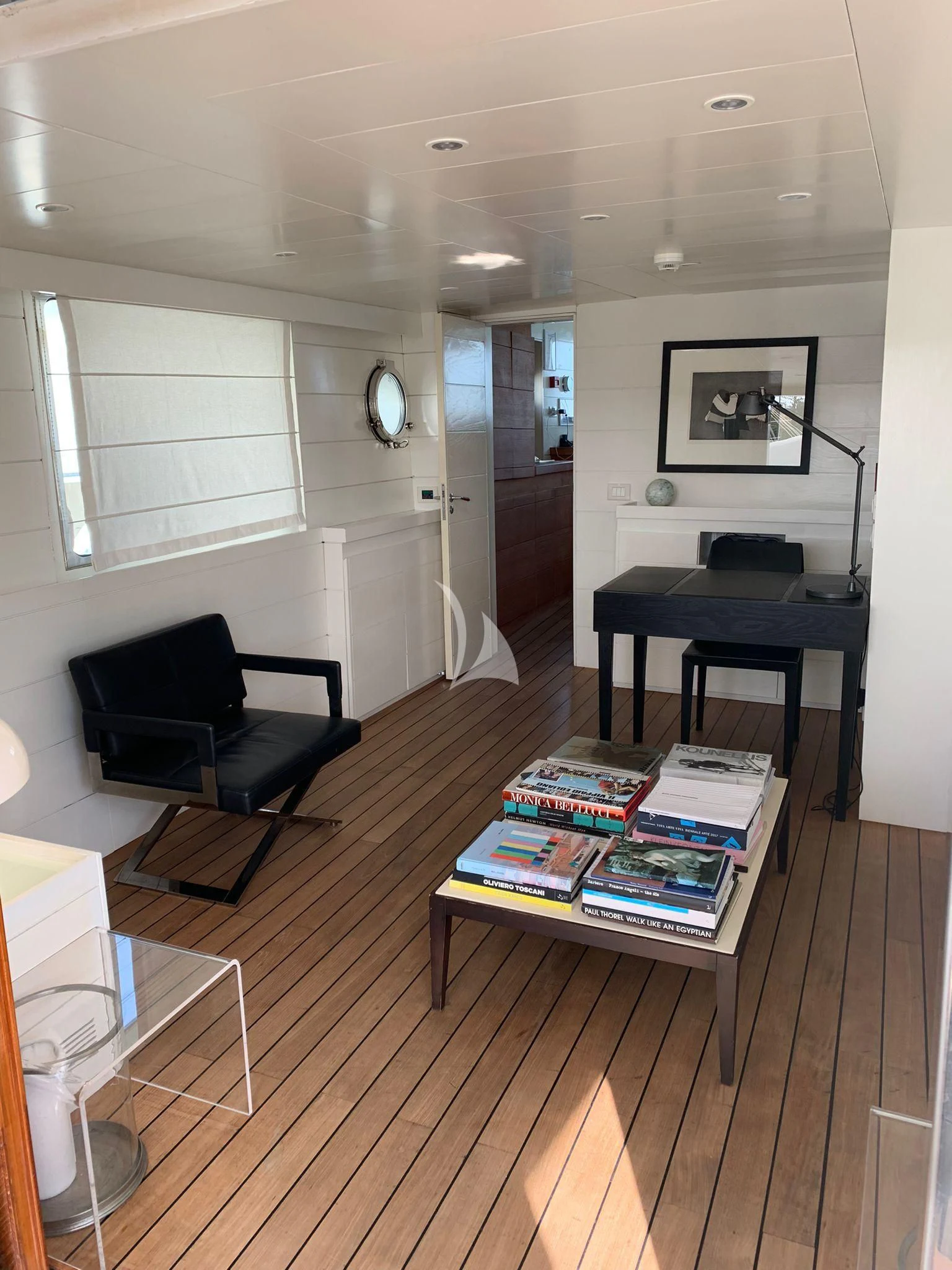 a black chair in a room aboard VERVECE Yacht for Charter