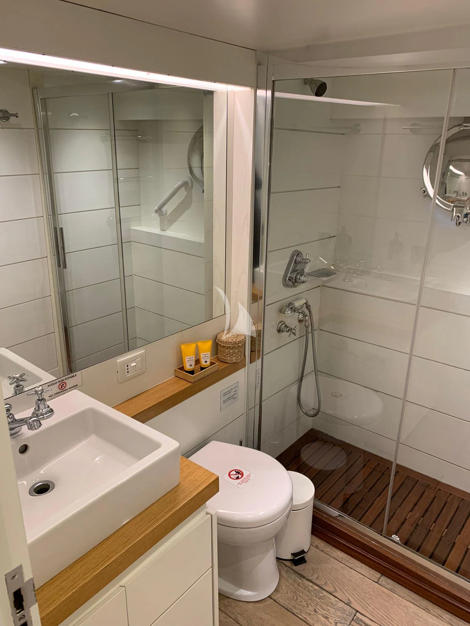 a bathroom with a toilet and sink aboard VERVECE Yacht for Charter