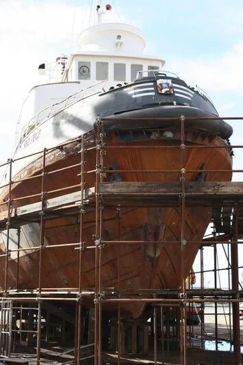 a large ship docked aboard VERVECE Yacht for Charter