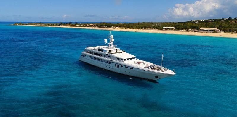 a white yacht in the water aboard APOGEE Yacht for Sale