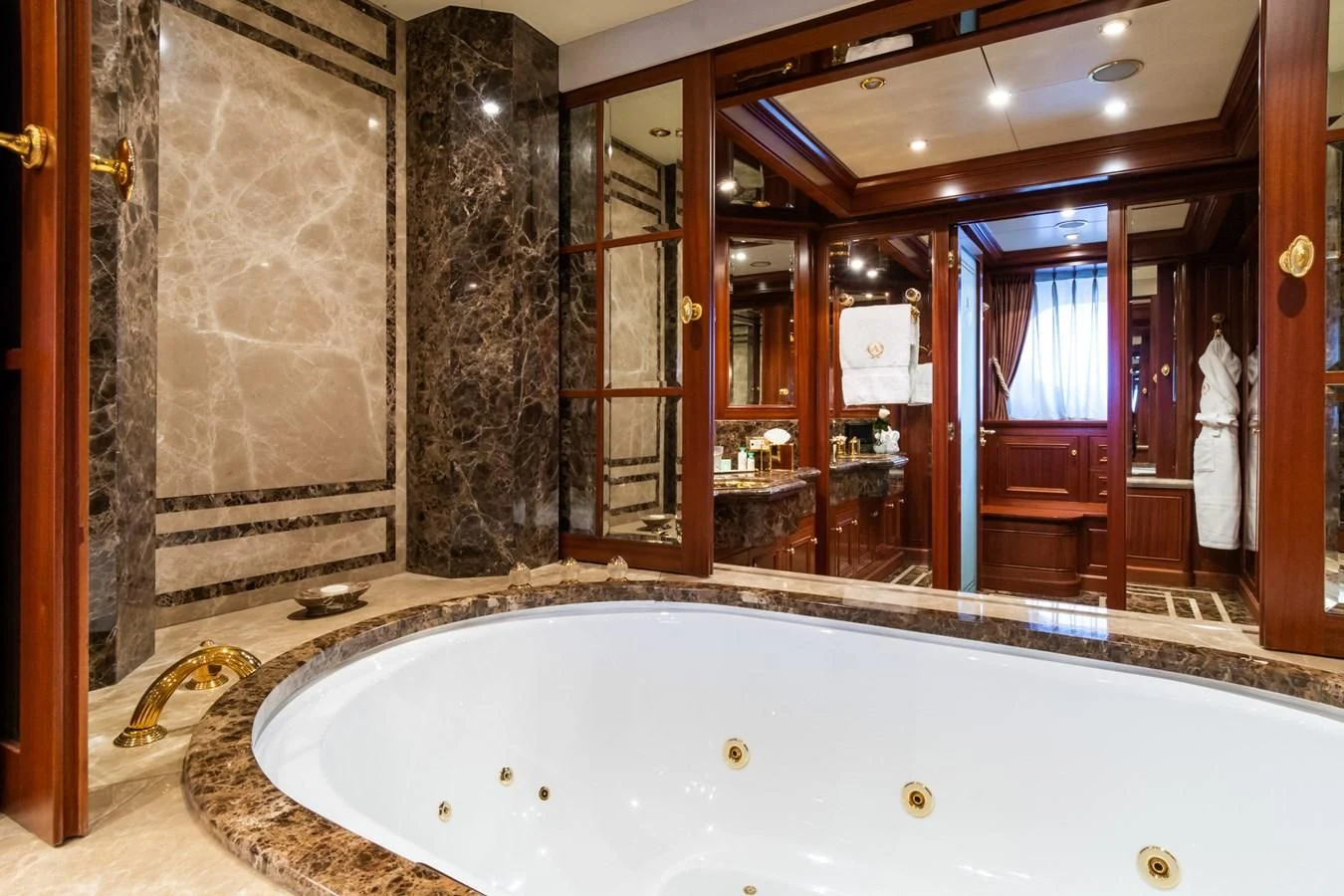 a large bathroom with a large tub aboard APOGEE Yacht for Sale