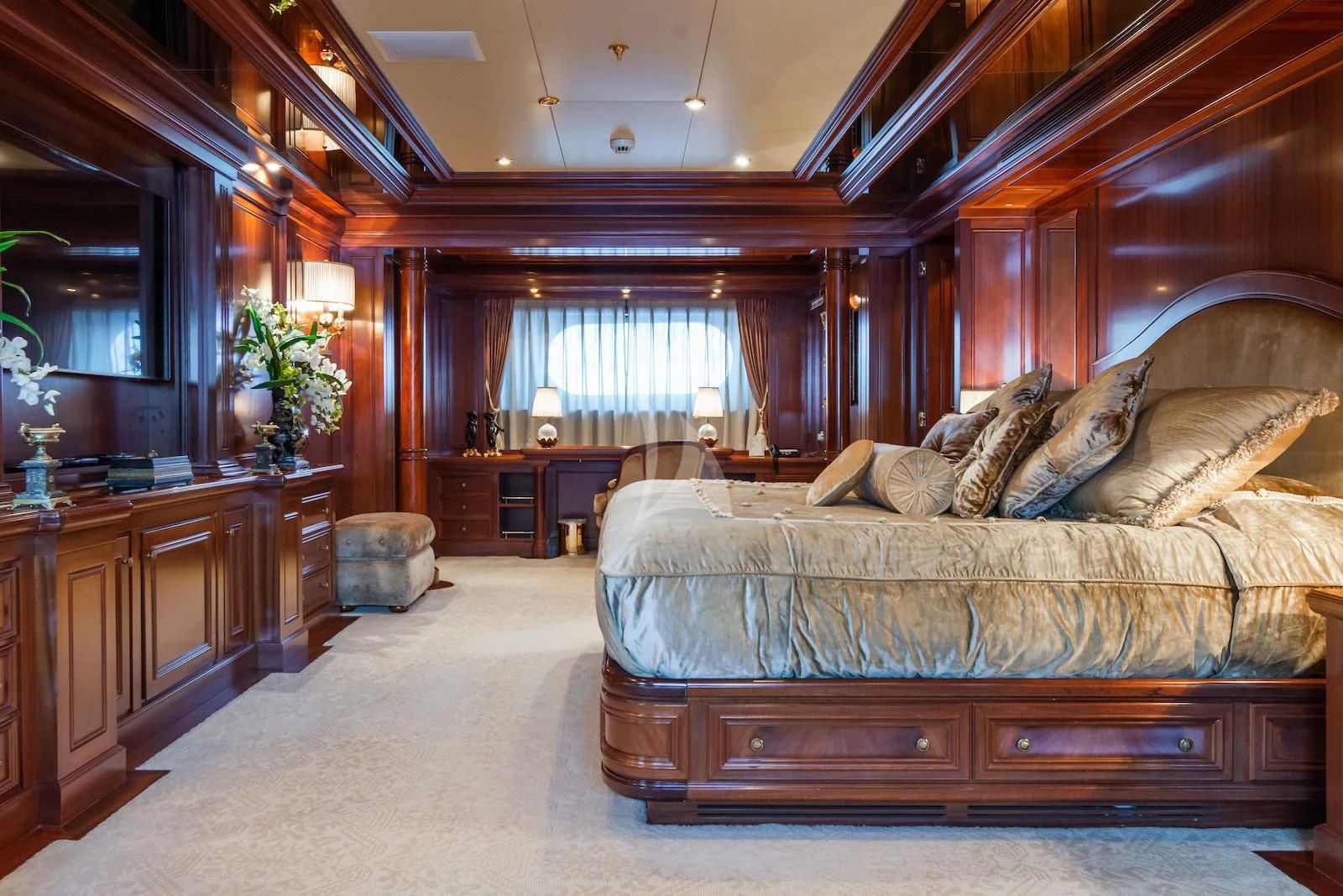a large living room with a large bed aboard APOGEE Yacht for Sale