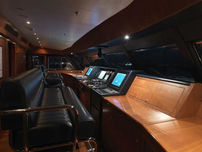 a train with a desk and laptops aboard APOGEE Yacht for Sale