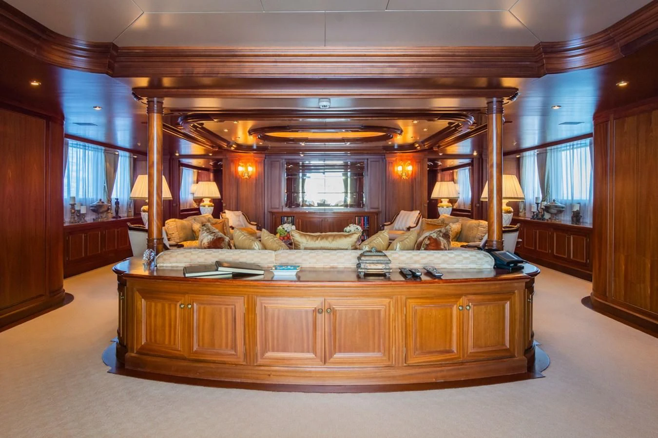 a large living room with a large mirror aboard APOGEE Yacht for Sale