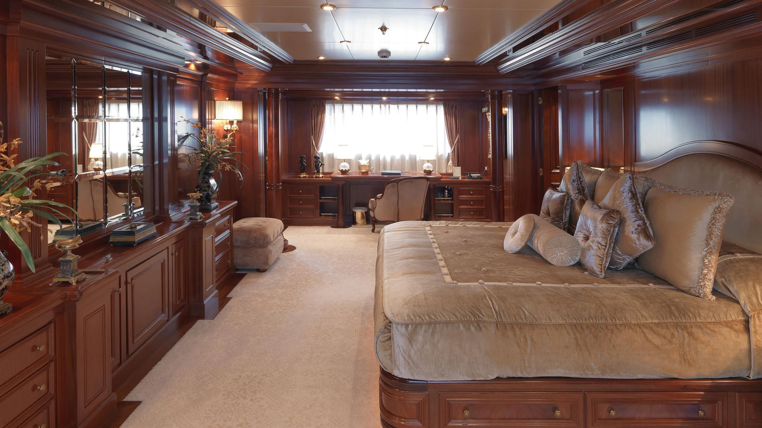 a living room with a couch and a table aboard APOGEE Yacht for Sale