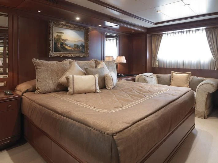 a large bed in a hotel room aboard APOGEE Yacht for Sale