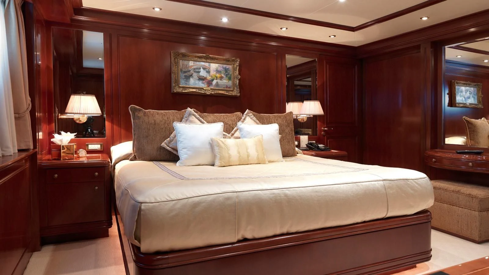 a bed with a white comforter aboard APOGEE Yacht for Sale
