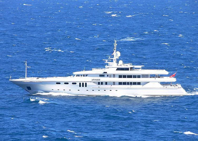 a large white boat in the water aboard APOGEE Yacht for Sale