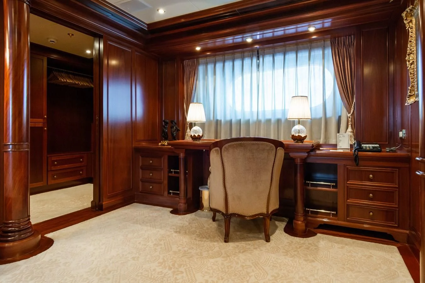 a large room with a desk and a chair aboard APOGEE Yacht for Sale