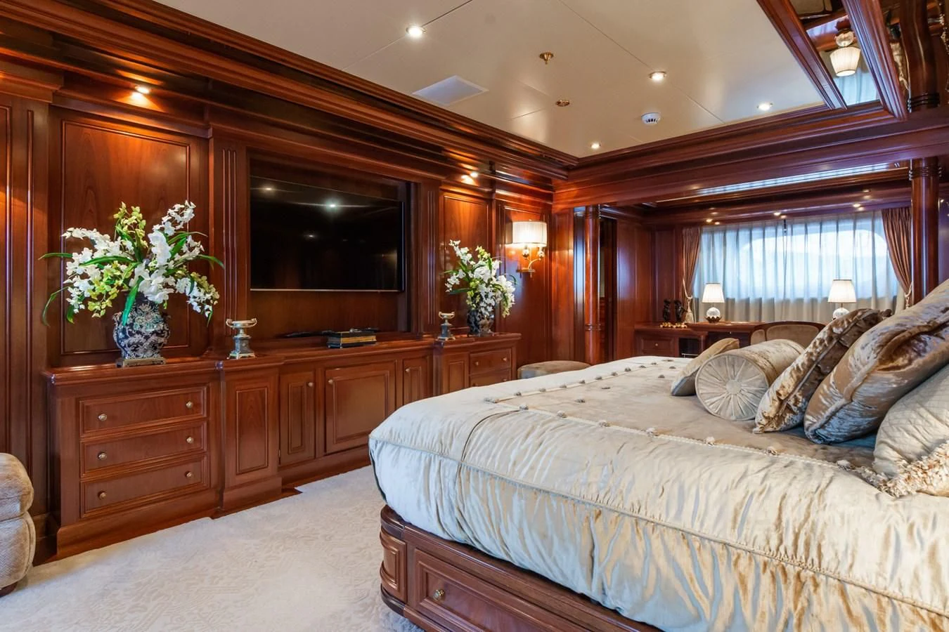 a bedroom with a large bed aboard APOGEE Yacht for Sale