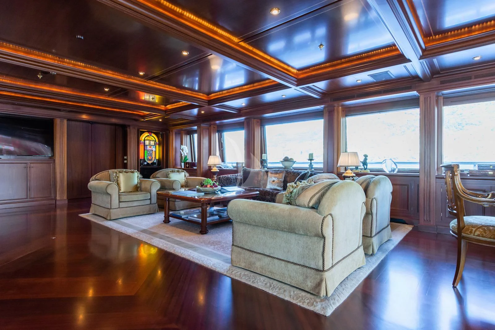 a living room with a large window aboard APOGEE Yacht for Sale