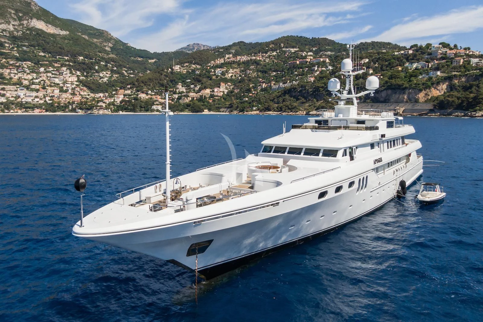 a white yacht in the water aboard APOGEE Yacht for Sale