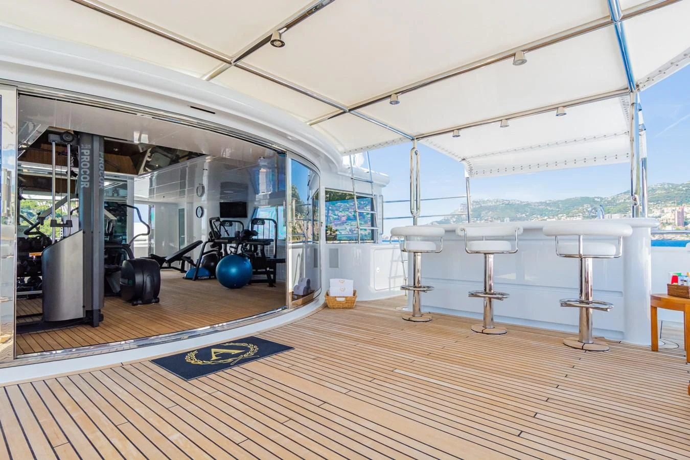 a room with a large white table and chairs and a large white table aboard APOGEE Yacht for Sale