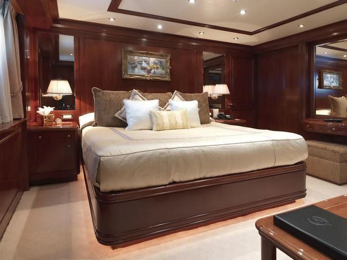 a bed in a room aboard APOGEE Yacht for Sale