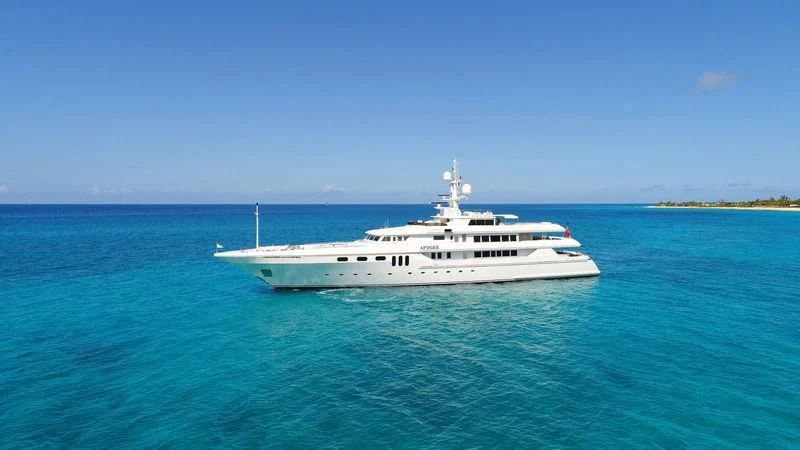 a white boat in the water aboard APOGEE Yacht for Sale