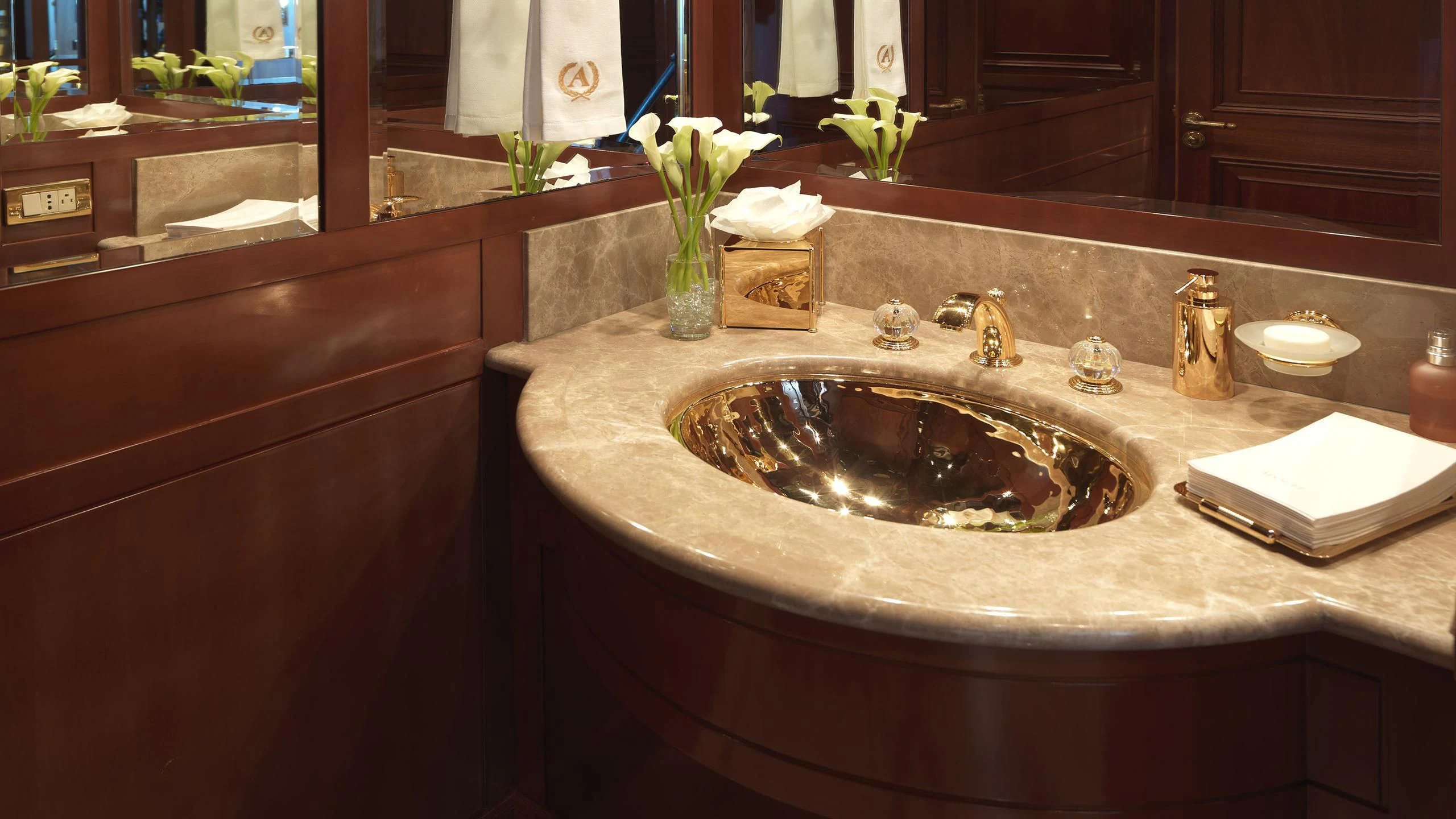 a sink with a flower in the sink aboard APOGEE Yacht for Sale