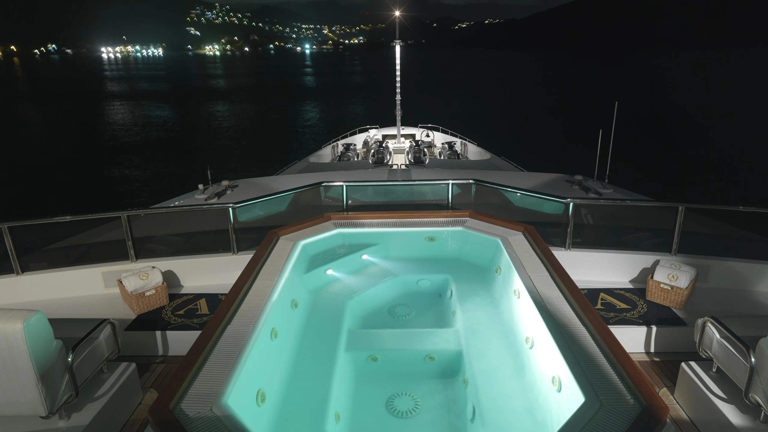 a large cruise ship in a harbor aboard APOGEE Yacht for Sale