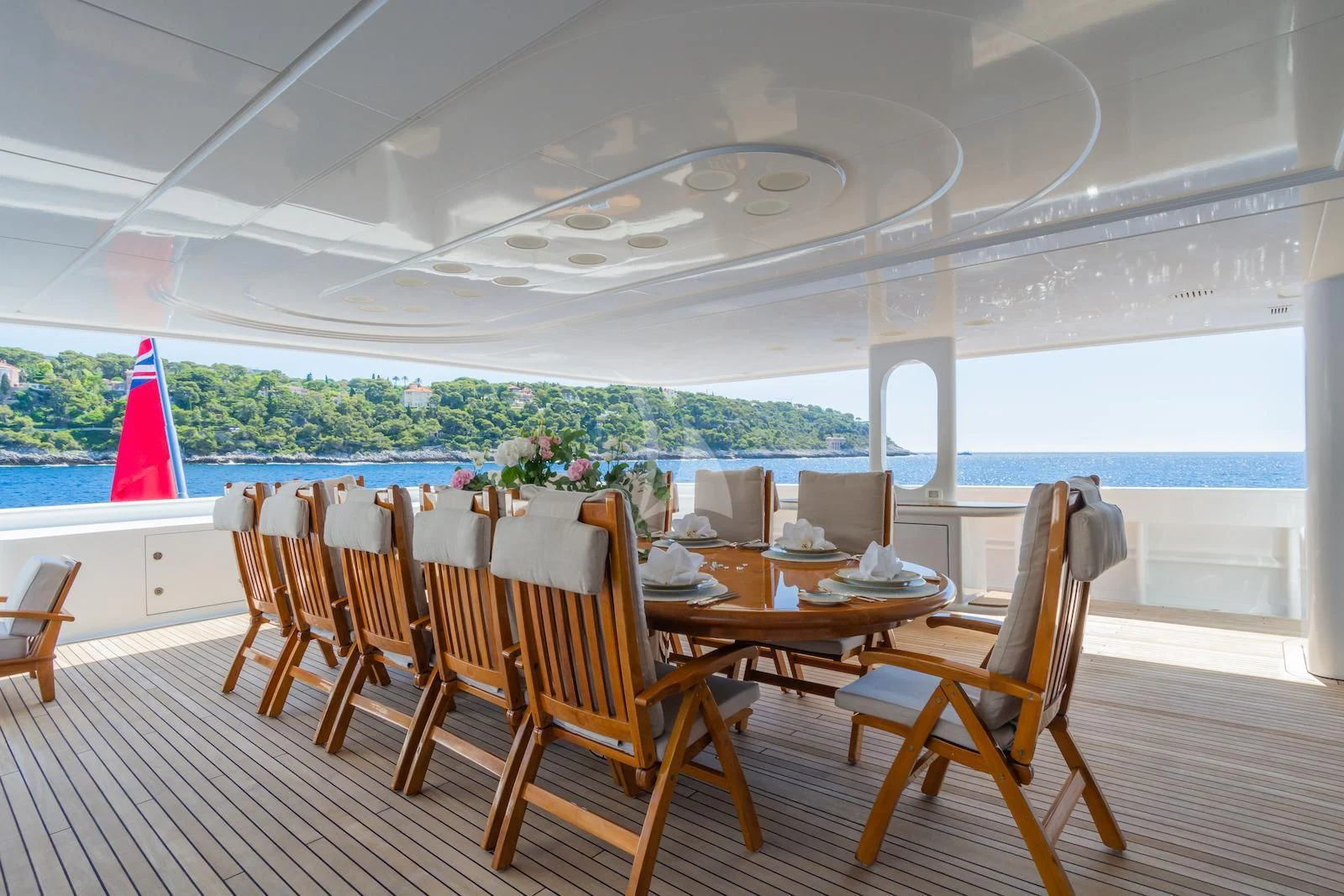 a room with tables and chairs aboard APOGEE Yacht for Sale