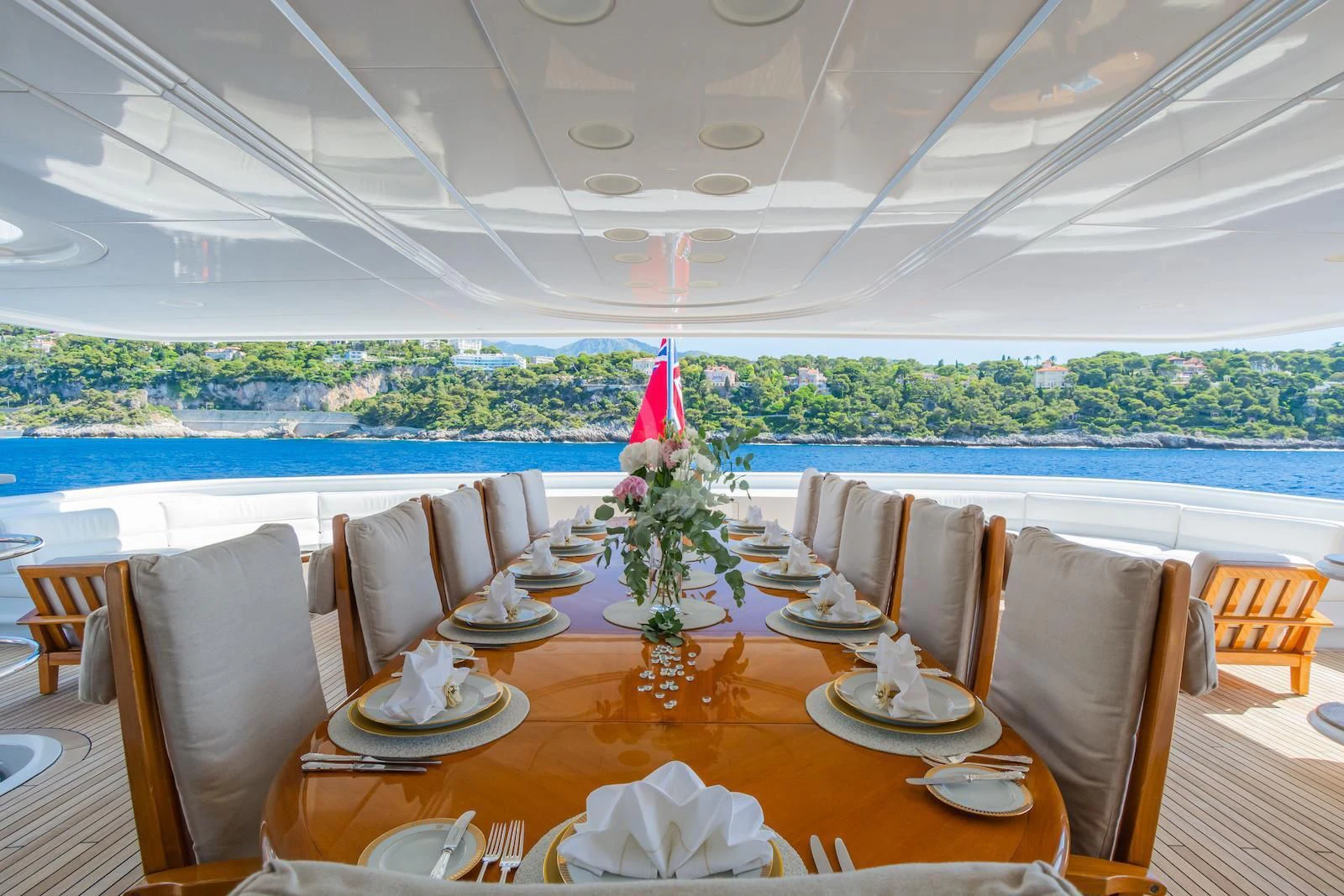 a table set for a dinner aboard APOGEE Yacht for Sale