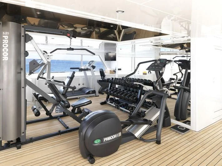 a gym with weights aboard APOGEE Yacht for Sale