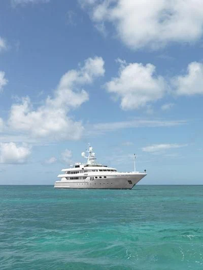 a white boat in the water aboard APOGEE Yacht for Sale