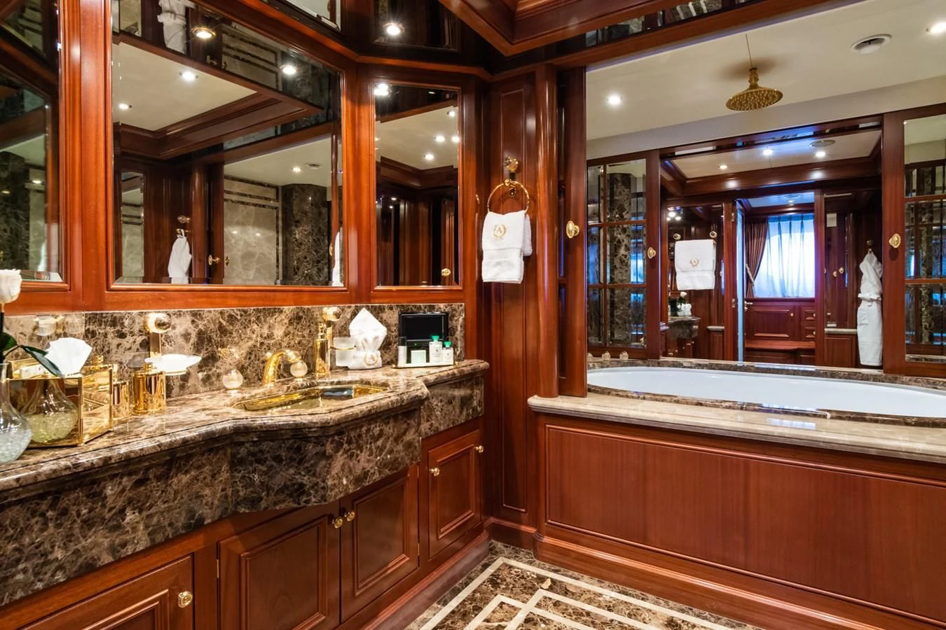 a bathroom with a marble counter top aboard APOGEE Yacht for Sale