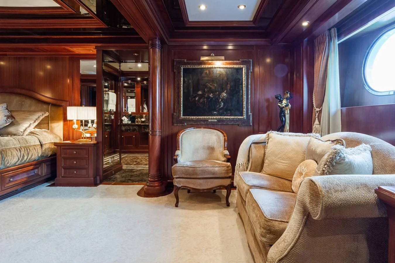 a room with a bed and a chair aboard APOGEE Yacht for Sale