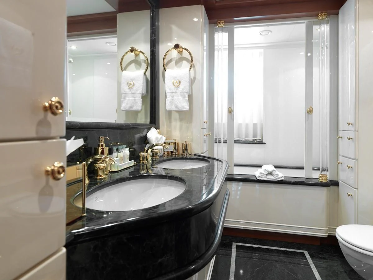 a bathroom with a sink and a bathtub aboard APOGEE Yacht for Sale