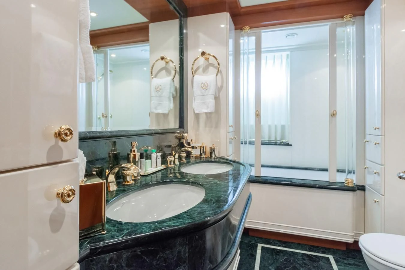 a bathroom with a sink and a bathtub aboard APOGEE Yacht for Sale