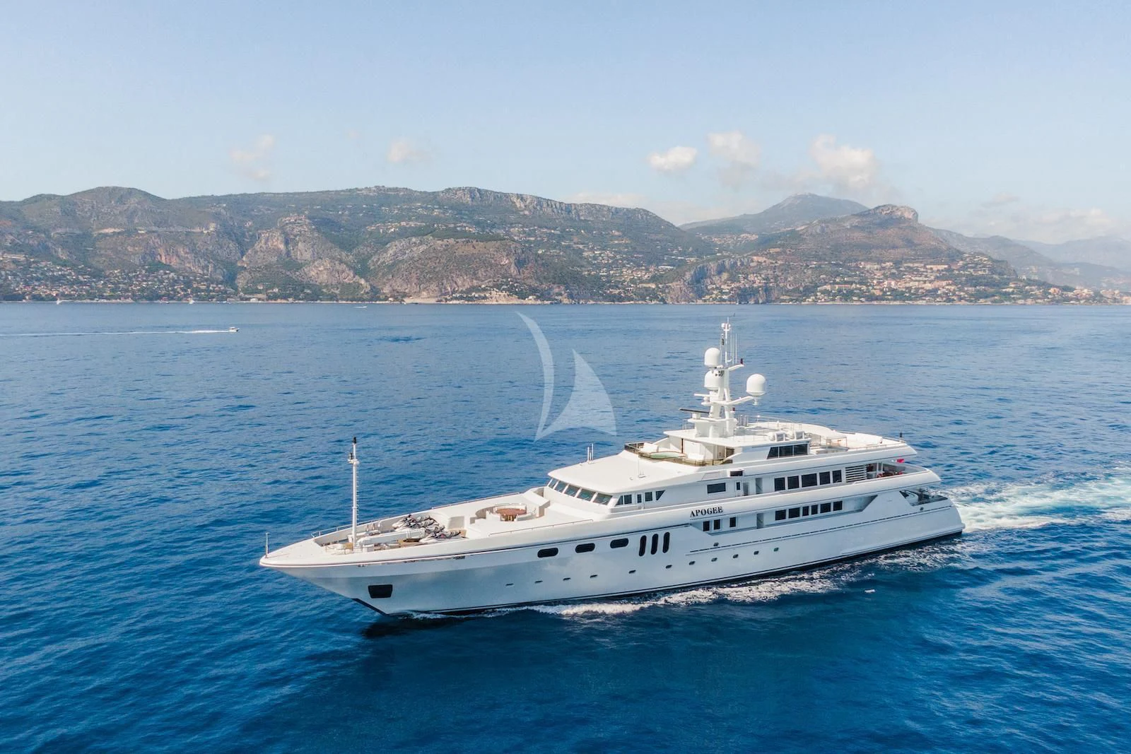 a white boat on the water aboard APOGEE Yacht for Sale
