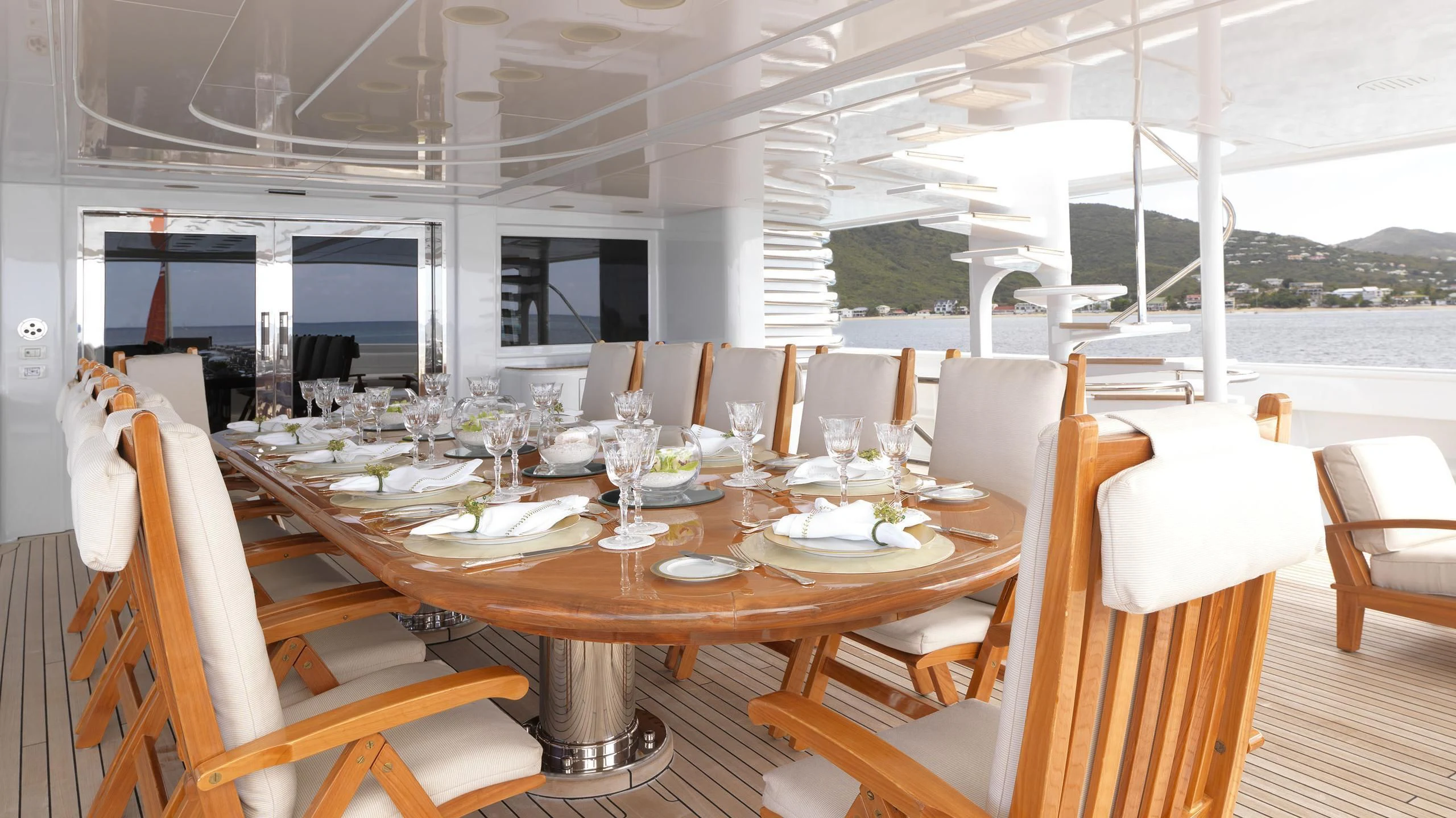 a table set for a dinner aboard APOGEE Yacht for Sale