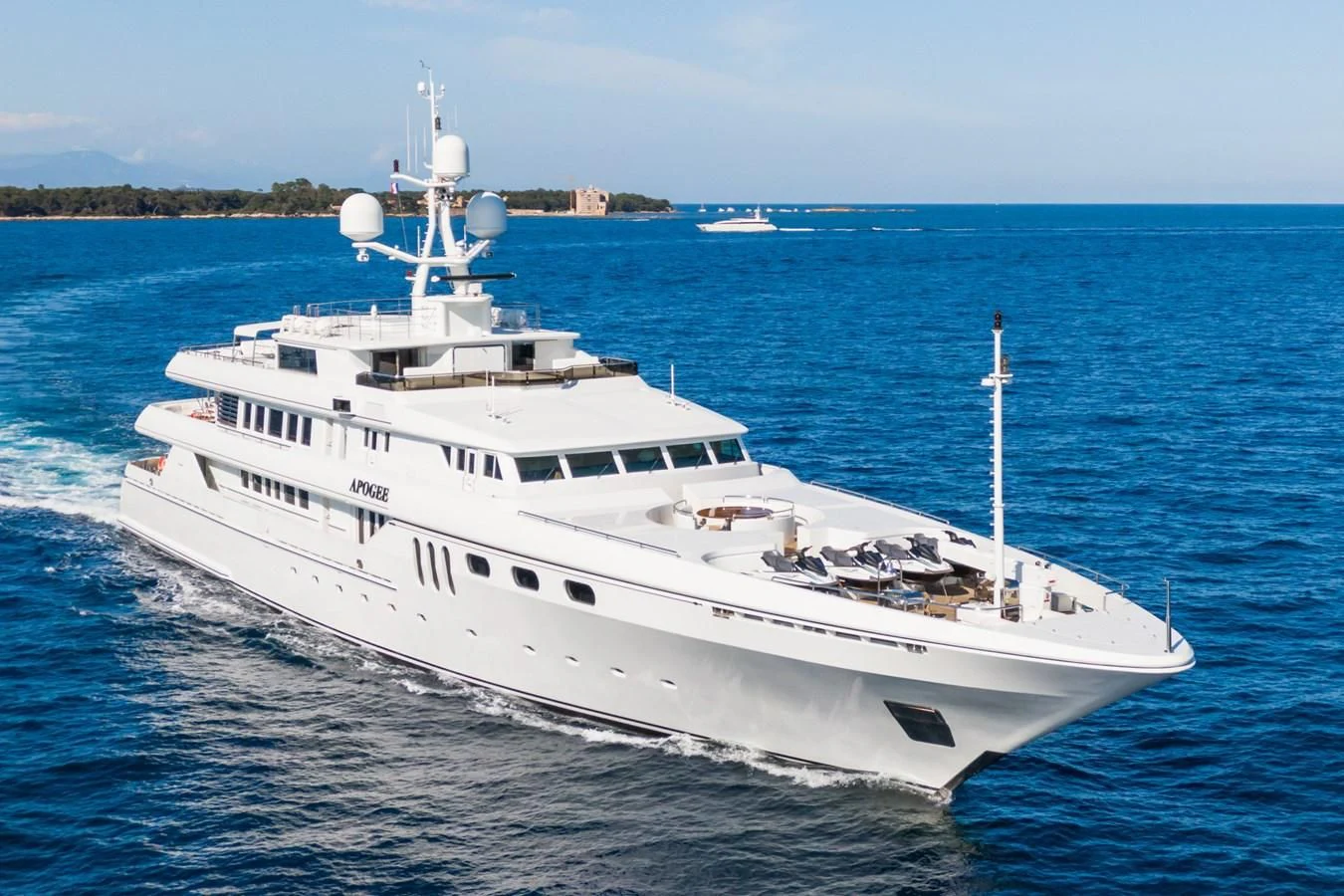 a large white boat in the water aboard APOGEE Yacht for Sale