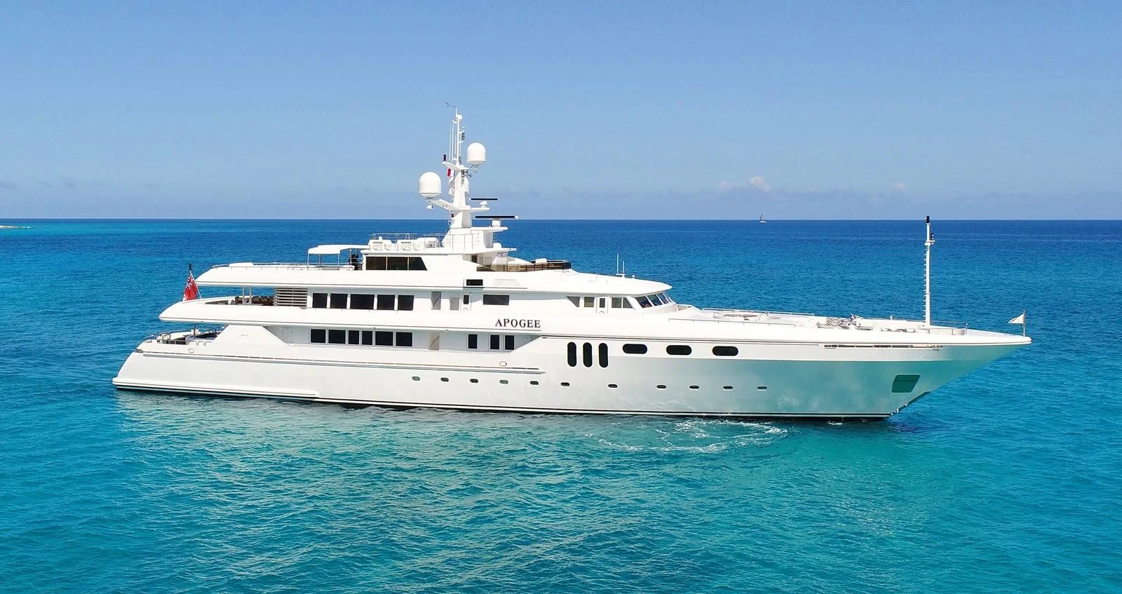 a large white boat in the water aboard APOGEE Yacht for Sale