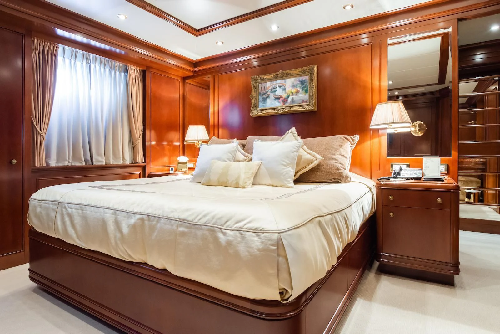 a bed with a white sheet aboard APOGEE Yacht for Sale