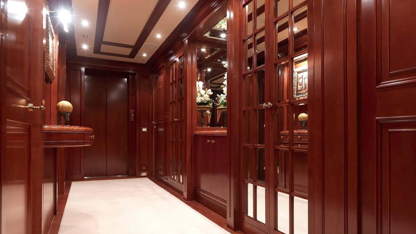 a room with wooden cabinets aboard APOGEE Yacht for Sale
