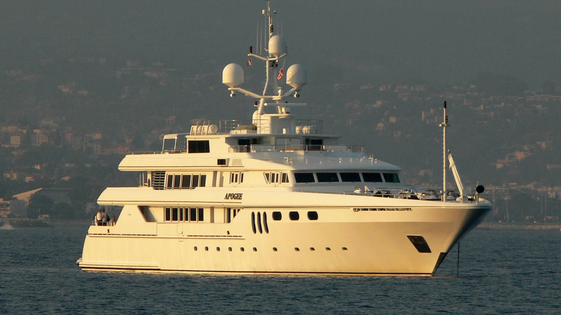 a large white boat in the water aboard APOGEE Yacht for Sale