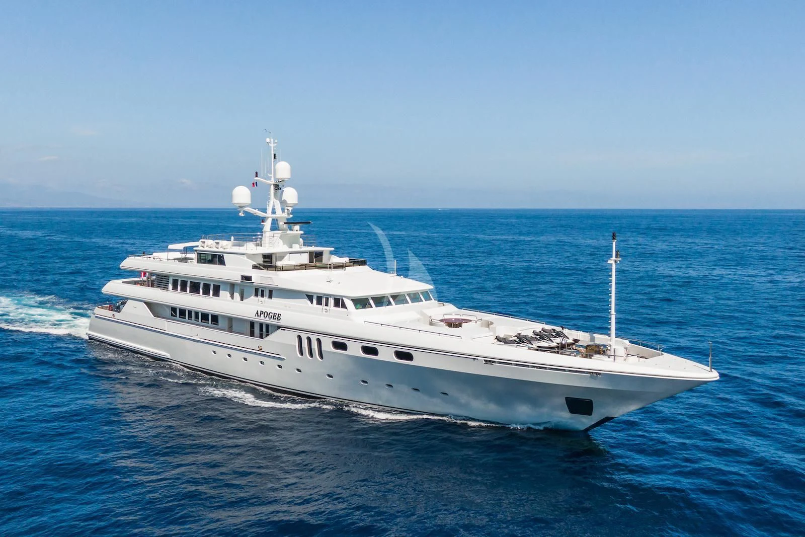 a large white yacht in the water aboard APOGEE Yacht for Sale