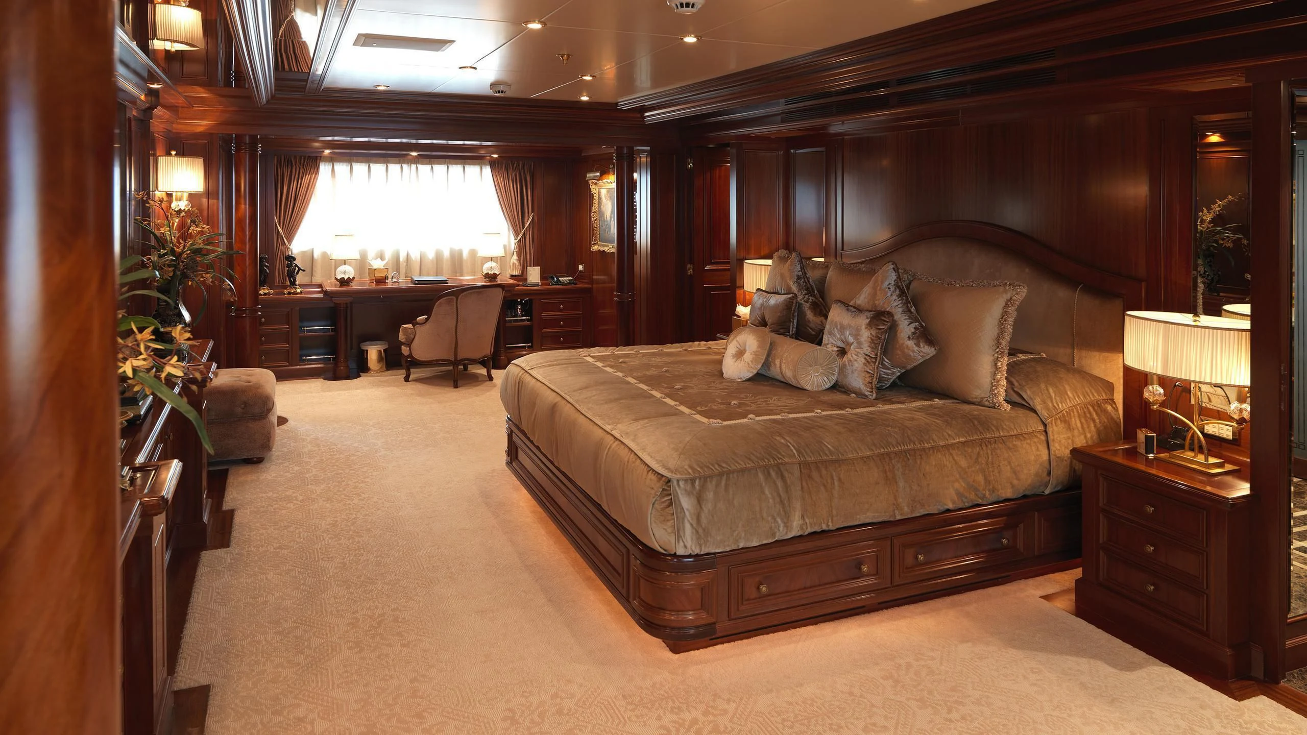 a large bed in a room aboard APOGEE Yacht for Sale
