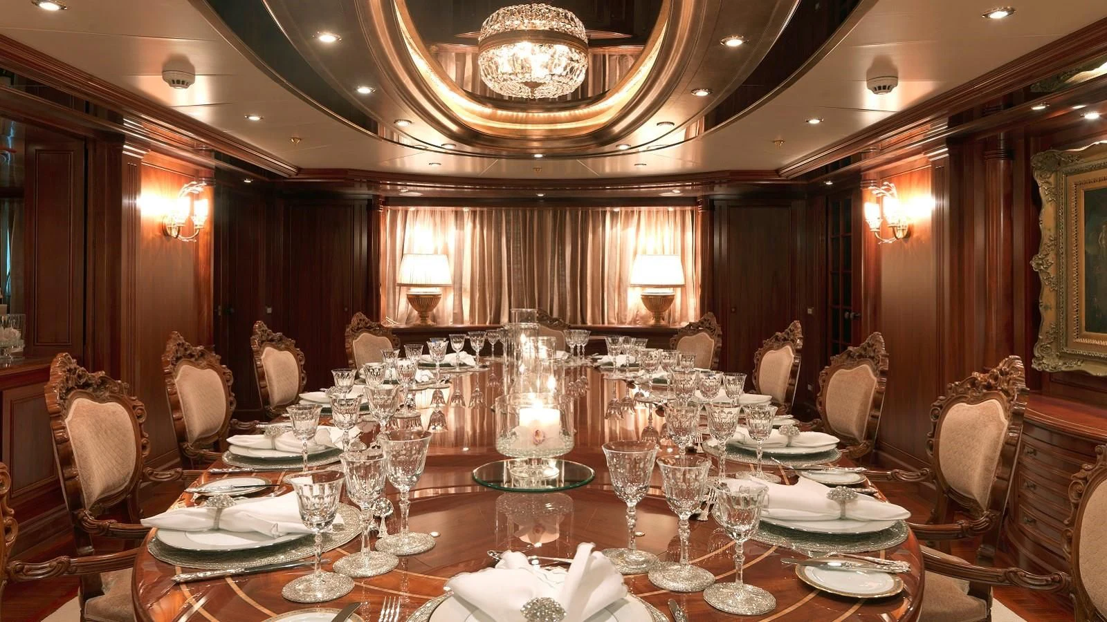 a large room with a table set aboard APOGEE Yacht for Sale