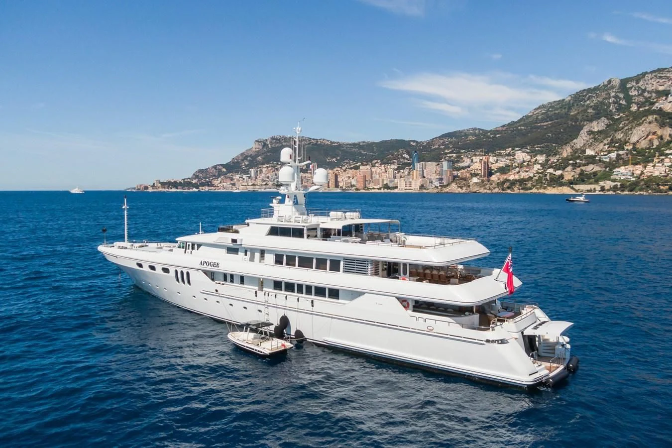 a large white yacht in the water aboard APOGEE Yacht for Sale